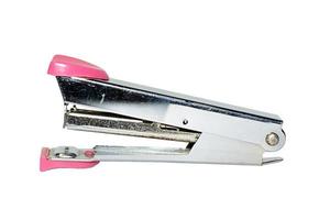 The old stapler on a white background. photo