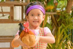Girl caught chicken photo