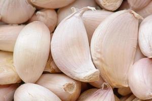 The garlic cloves at market, texture background. photo