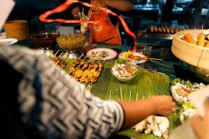 Food at a street market in the evening in Krabi photo