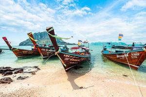 View of the long-tail boat and the beach on the island,tropical sea photo