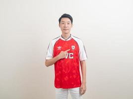 Bangkok, THAILAND - Nov 27, 2021 - Young Asian man wearing Arsenal shirt with white background. photo