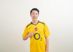 Bangkok, THAILAND - Nov 27, 2021 - Young Asian man wearing Arsenal shirt with white background. photo