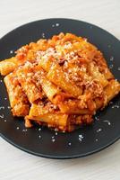 Rigatoni pasta bolognese with cheese photo