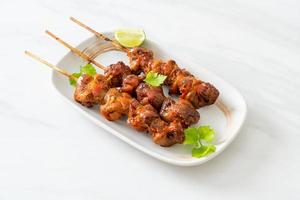 grilled chicken gizzard skewer with herbs and spices photo
