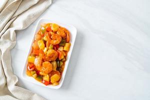 Stir-fried sweet and sour with fried shrimp photo