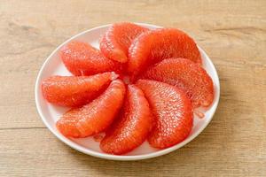 fresh red pomelo fruit or grapefruit photo