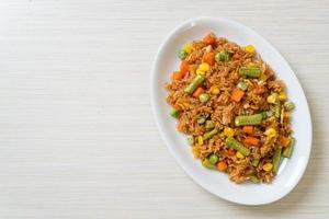 fried rice with green peas, carrot and corn photo