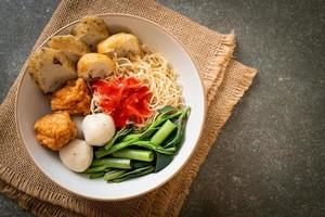 egg noodles with fish balls and shrimp balls in pink sauce, Yen Ta Four or Yen Ta Fo