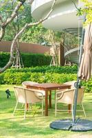 outdoor patio table and chair in garden photo