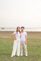Happy young Asian couple in bride and groom t-shirt