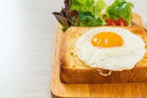 bread toasted with cheese and fried egg photo