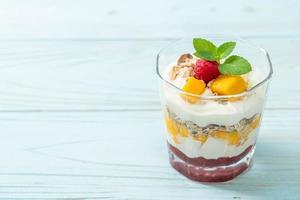 homemade mango and raspberry with yogurt and granola photo