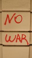 No war, isolated red text written on the wall.