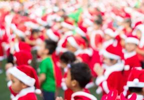 Studrent in red theme costume in Christmas party of elementary school photo