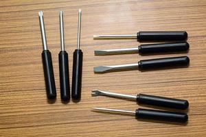 The screwdriver pack on a wood background. photo