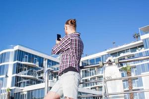 Young bearded man make selfie on phone photo
