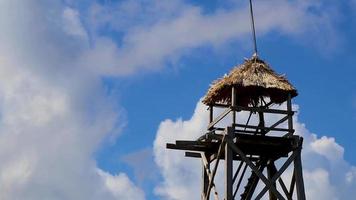 Wooden viewpoint tower with blue sky Muyil Lagoon panorama Mexico.