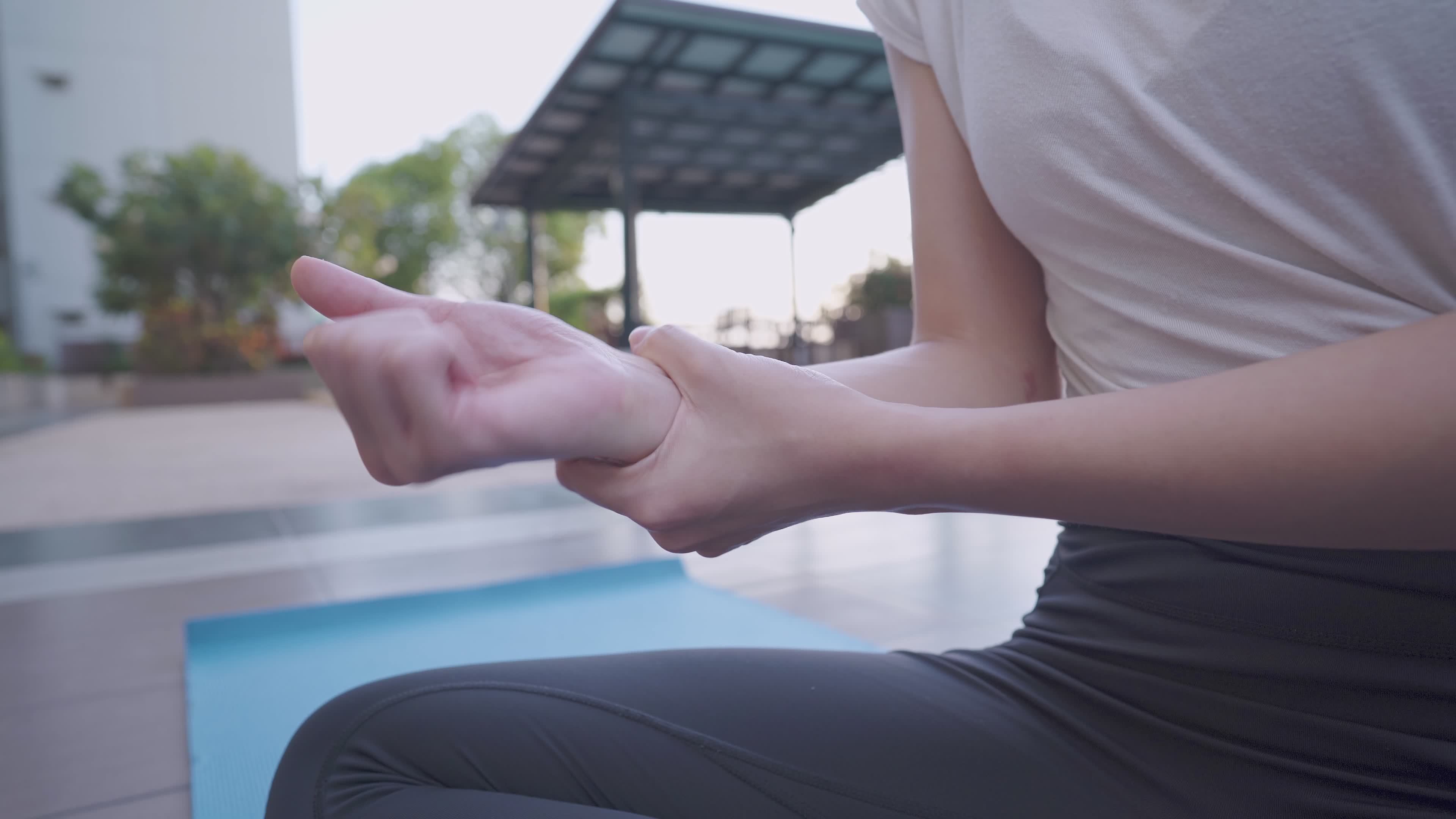 Close up woman rotating he right Wrist, touching and massaging on the