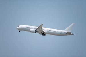 A commercial airplane taking off at an airport. photo