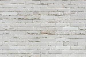 Abstract weathered texture stained old stucco light gray and aged paint white brick wall background photo