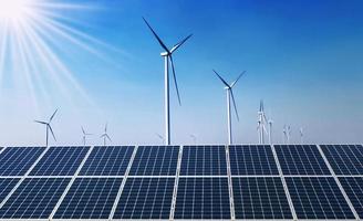 concept clean energy power in nature. solar panel with wind turbine and blue sky background photo