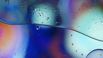 Abstract Colorful Food Oil Drops Bubbles and spheres Flowing on Water Surface, macro Videography video