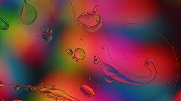 Abstract Colorful Food Oil Drops Bubbles and spheres Flowing on Water Surface, macro Videography video