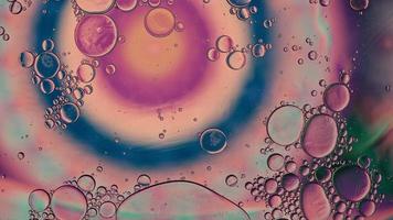 Abstract Colorful Food Oil Drops Bubbles and spheres Flowing on Water Surface, macro Videography video