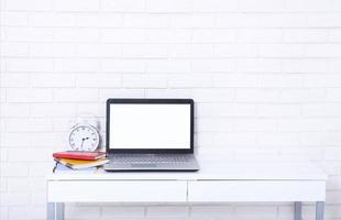 Workspace with laptop and other work accessories with copy space. Blank, template computer screen. Selective focus. Education business concept photo