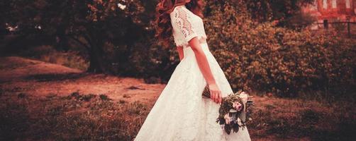 beautiful bride with a bouquet of flowers photo