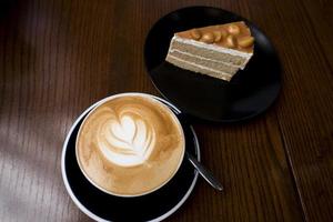 Latte on a wooden table photo