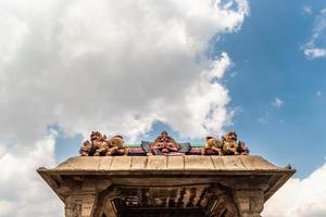 A colorful mandapa with a blue sky background in the temple town of Srirangam photo