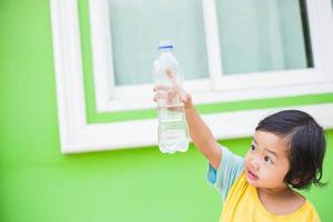 Thirsty Girl Drinking Water Outdoors photo