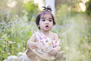 Cute girl smiling brightly in the setting sun photo