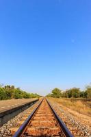 Railway tracks with blue sky in the evening photo