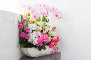 Artificial flower in the vase photo