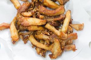 Fried pork with sesame on fat absorbing paper photo