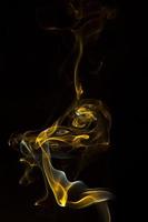 Colorful smoke on black background photo