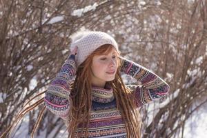 portraits of beautiful young woman in winter park photo