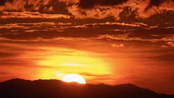 Timelapse of dramatic sunset with orange sky in a sunny day. video