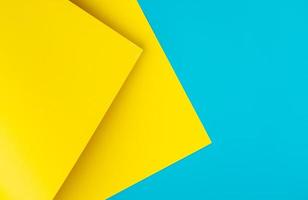 Urkaine yellow and blue colored background of layered cardboard sheets, top view, copy space photo