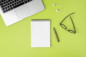 Blank empty space on white spiral notebook for text. Modern workspace concept, top view