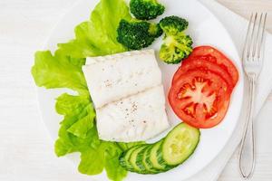 Steamed cod fish. Paleo, keto, fodmap healthy diet with vegetables photo