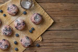 Blueberry muffin, top view, copy space. Cupcakes with berries photo