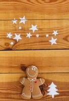 Christmas gingerbread cookies on wooden background photo
