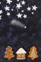 Christmas gingerbread cookies on dark background photo