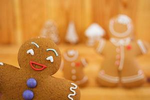 Christmas gingerbread cookies on wooden background photo