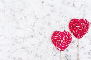 Colorful lollipops on white background. Top view photo