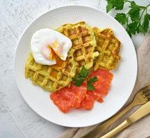 Zucchini waffles with salmon and benedict egg, fodmap diet top view photo